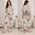 woman modeling a satin halloween pajama set with haunted library and ghost
