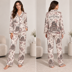 woman modeling a satin halloween pajama set with haunted library and ghost
