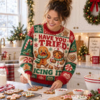 gingerbread nurse christmas sweater being iced on a holiday kitchen counter