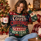 woman wearing a multicoloured ugly christmas sweater with the slogan here's to