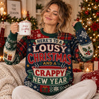 woman holding a mug while modelling a funny holiday jumper that reads