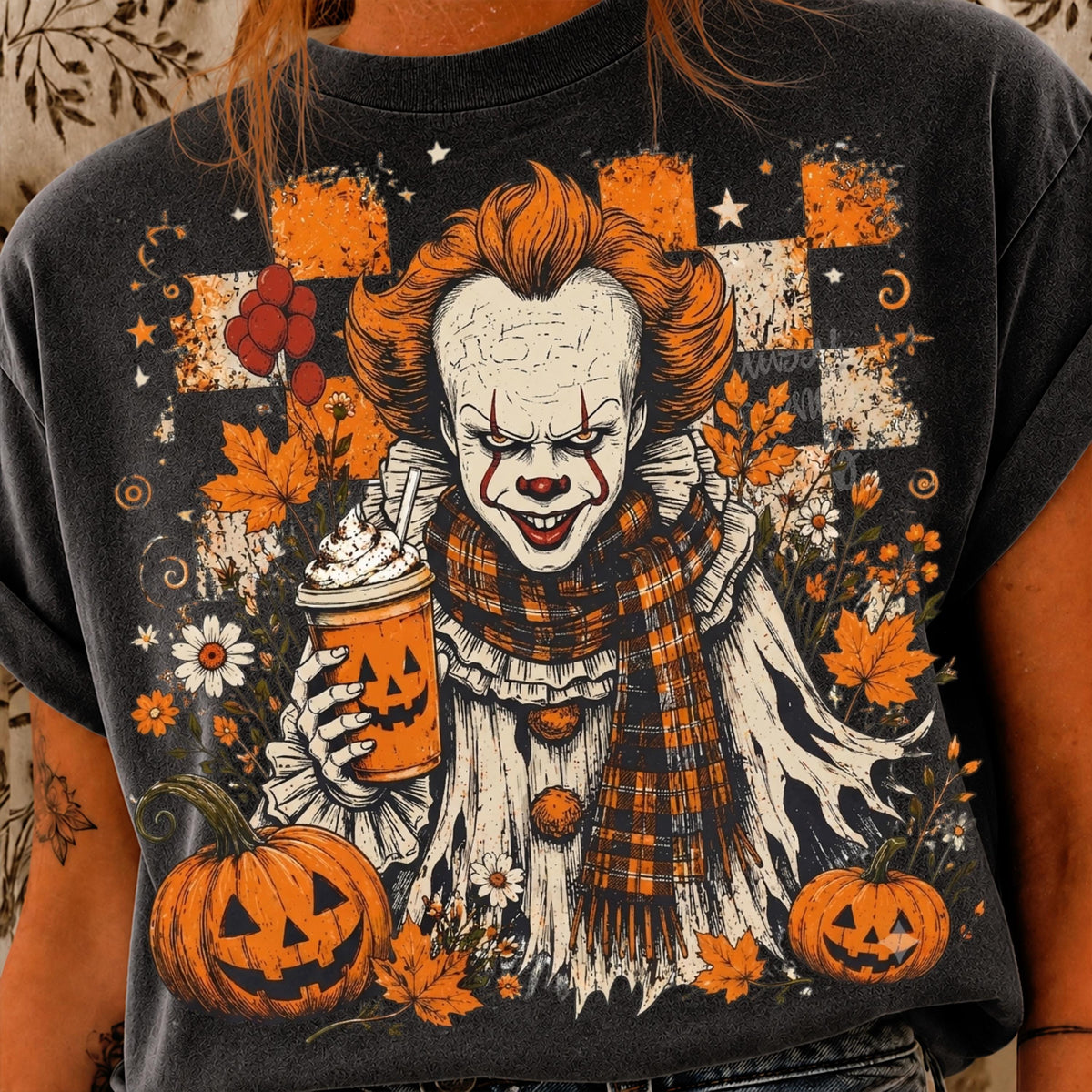 graphic tee featuring Pennywise clown in a ruffled collar and plaid scarf