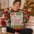 smiling model in a i'm booked ugly sweater with peace signs