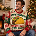 couple wearing matching taco ugly christmas sweater in front of tree