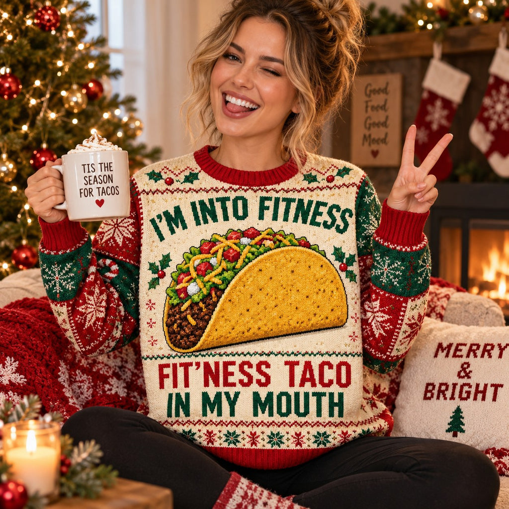 woman holding hot cocoa in matching taco ugly christmas sweater