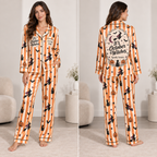 woman wearing orange striped halloween satin pajama set