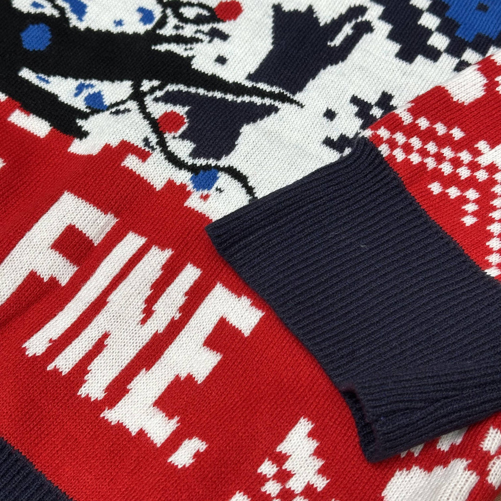 close up of knitted ribbed cuff on red navy ugly christmas sweater