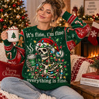 woman wearing funny skeleton christmas lights coffee holiday sweater sitting by tree