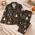 black ghost pumpkin satin pajamas flat lay with a custom name on the chest