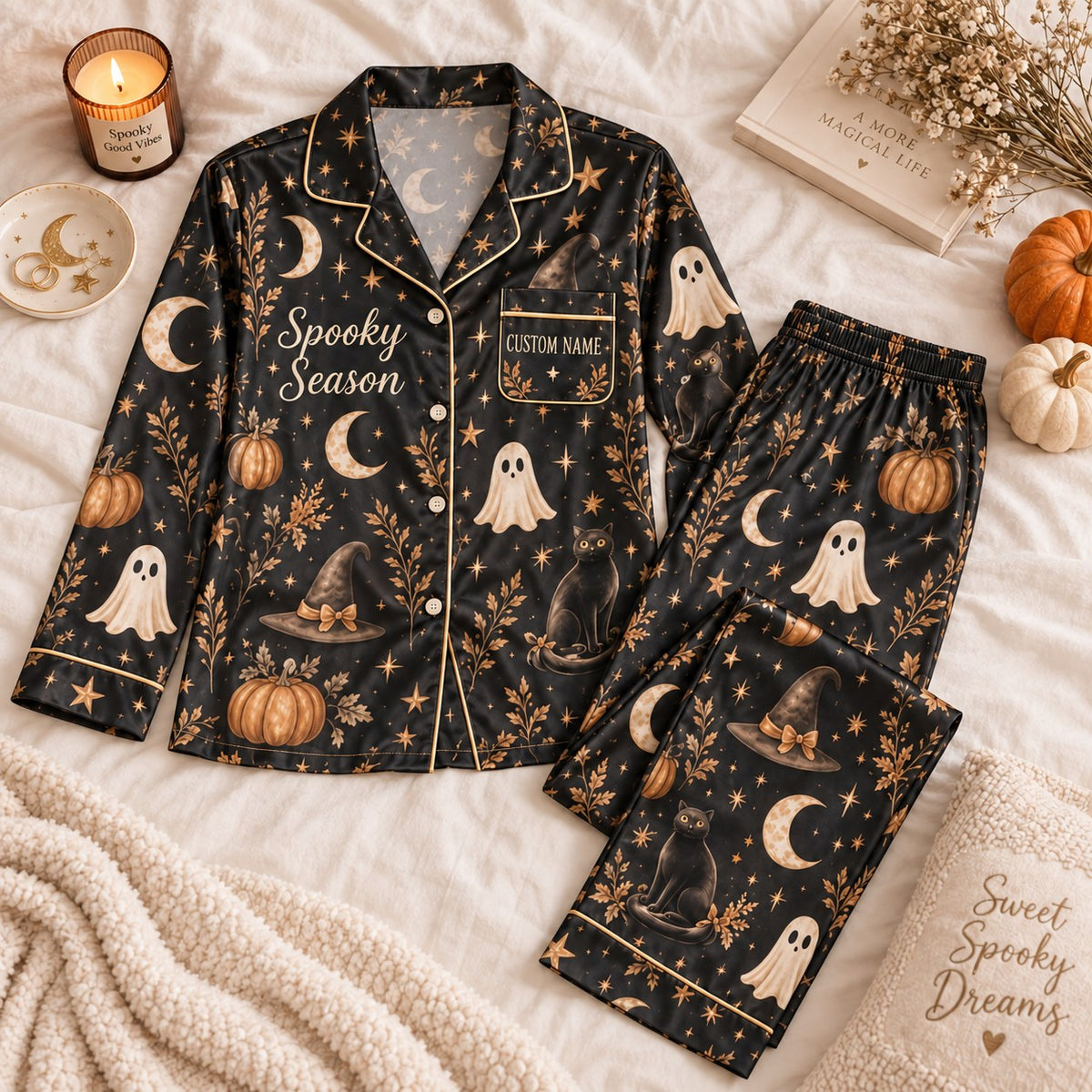 black ghost pumpkin satin pajamas flat lay with a custom name on the chest