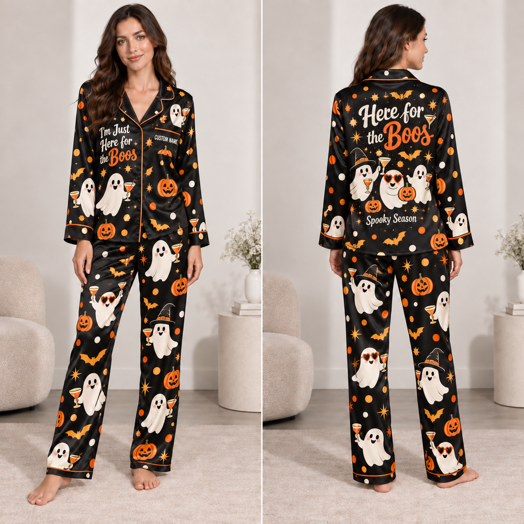 woman modeling a black satin pajama set with halloween ghost and pumpkin