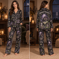 woman modeling black halloween pajamas with haunted castle and moon print