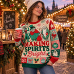 woman in a pom beanie holding a hot chocolate cup wearing a