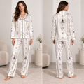 woman modeling cream satin pajama set with all-over meditation, lotus, moon