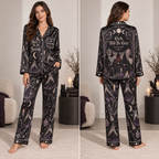 woman modeling a black satin pajama set with a meet me
