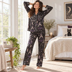 woman sitting on a bed holding a moon mug in a witchy