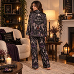 back view of a witch broomstick halloween satin pajama set
