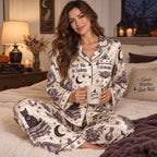 back view of salem witch satin pajama set showing haunted castle graphic