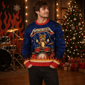 man wearing a blue cat ugly christmas sweater with drum kit design