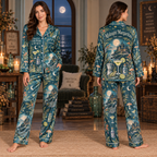 woman modeling teal satin pajamas with moon, mushroom and castle print, optional