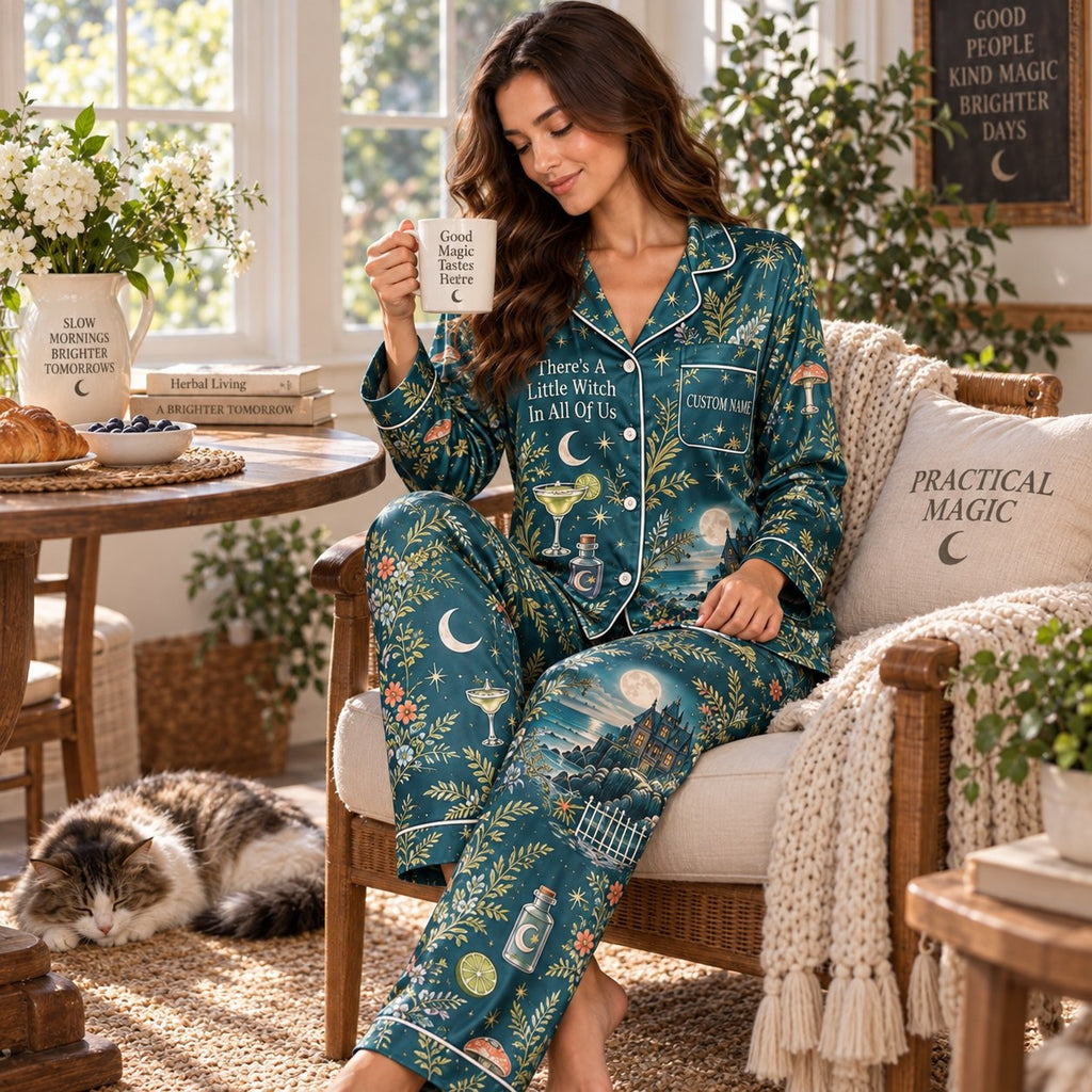 woman in teal witchy satin pajamas holding a coffee mug, sitting