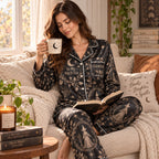 model holding a mug in Halloween witch satin pajamas
