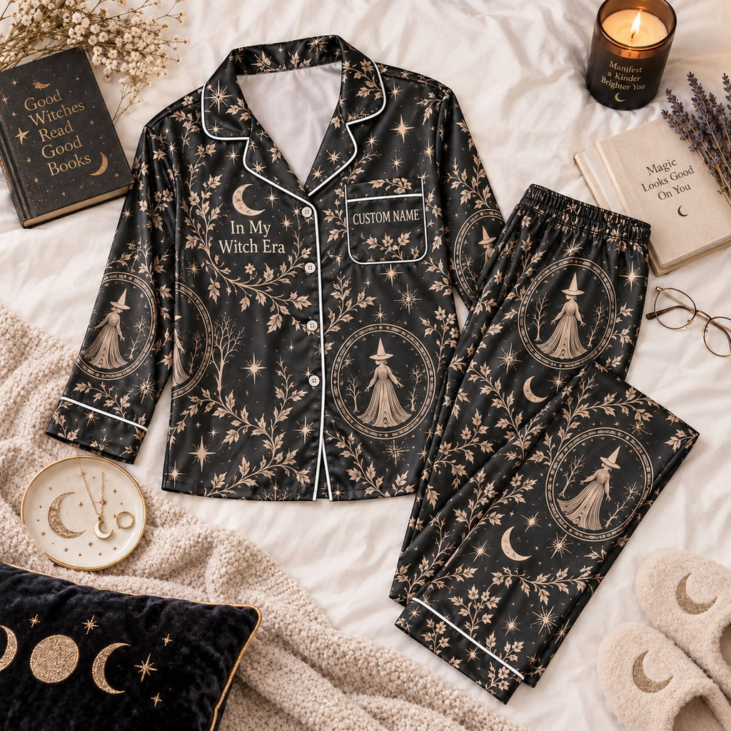 black witch print satin pajamas flat lay with a custom name on the chest