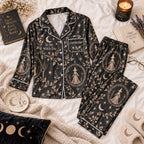 black witch print satin pajamas flat lay with a custom name on the chest