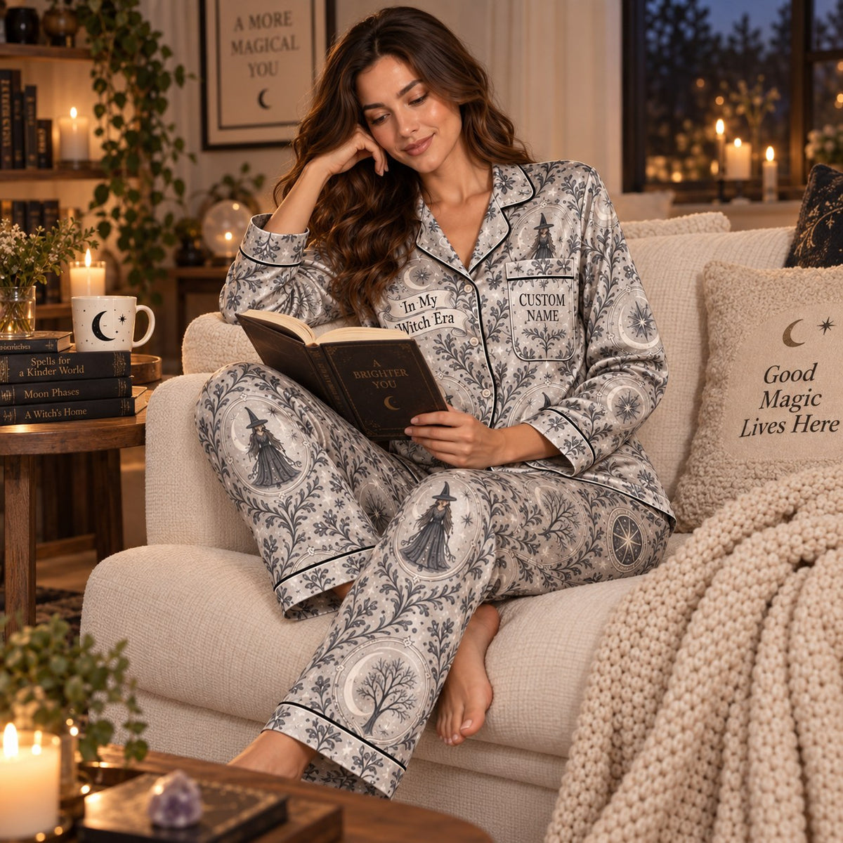 woman reading book in matching halloween pajama set on couch