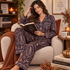 model on a bed holding a mug in the same halloween satin