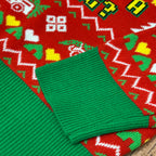 tight crop showing the green ribbed collar of the jacquard knit christmas