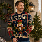 man in a nutcracker ugly christmas sweater standing by a holiday wreath