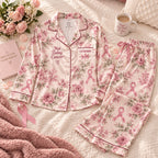 floral pink ribbon satin pajamas flat lay with a custom name on the chest