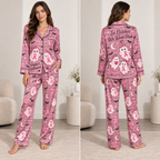 front view of pink satin halloween pyjamas with breast cancer ghost print