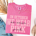 pink graphic tee reading in october we wear pink folded on white