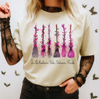 beige t-shirt with pink ribbon witch broom breast cancer design worn with