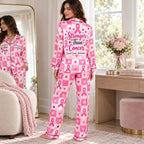 satin pajama set in bedroom setting with pink awareness month print
