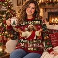 smiling woman holding a christmas mug in an ugly christmas sweater with