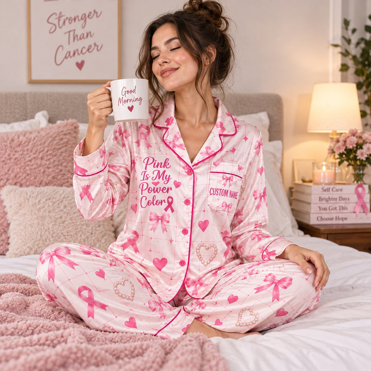 model in pink bow print satin pajamas with a custom name on the chest