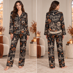 front view of black satin Halloween pajama set with all-over haunted house