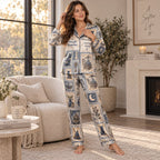 model reading a book in the satin pajama set beside a candle