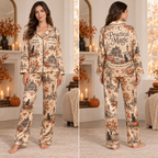 woman modeling a satin pajama set with a haunted house and black
