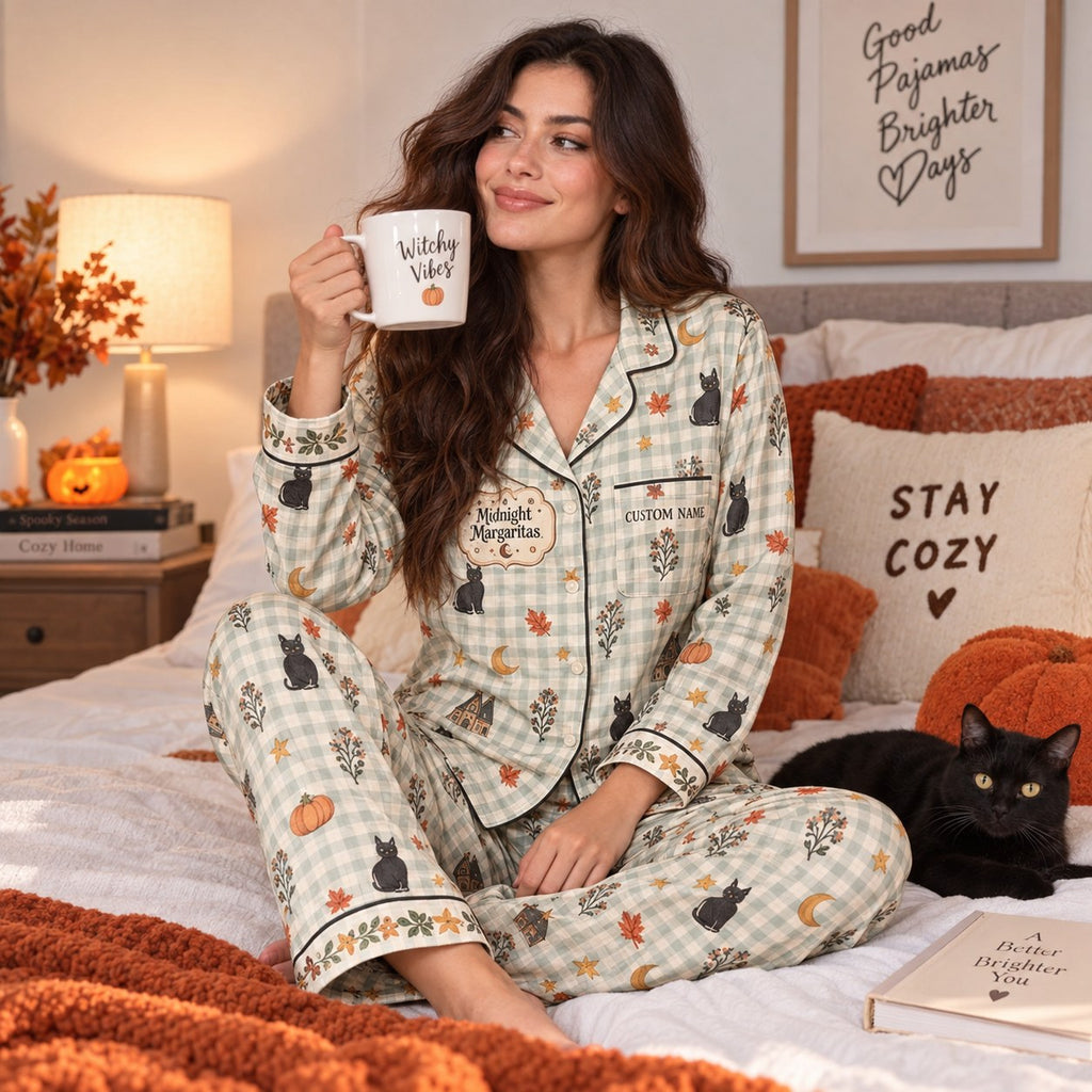 woman in pajama set sitting with a dog in a halloween decorated