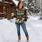 woman in ugly christmas sweater standing in snowy yard holding coffee near