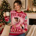 woman wearing a pink ugly christmas sweater with put me in coach