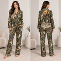 woman wearing an olive green satin pajama set with a haunted library