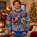 man wearing the reason vs the season ugly christmas sweater indoors near