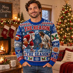 man wearing the reason vs the season ugly christmas sweater indoors near