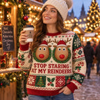 woman in beanie holding a coffee cup in a reindeer christmas jumper
