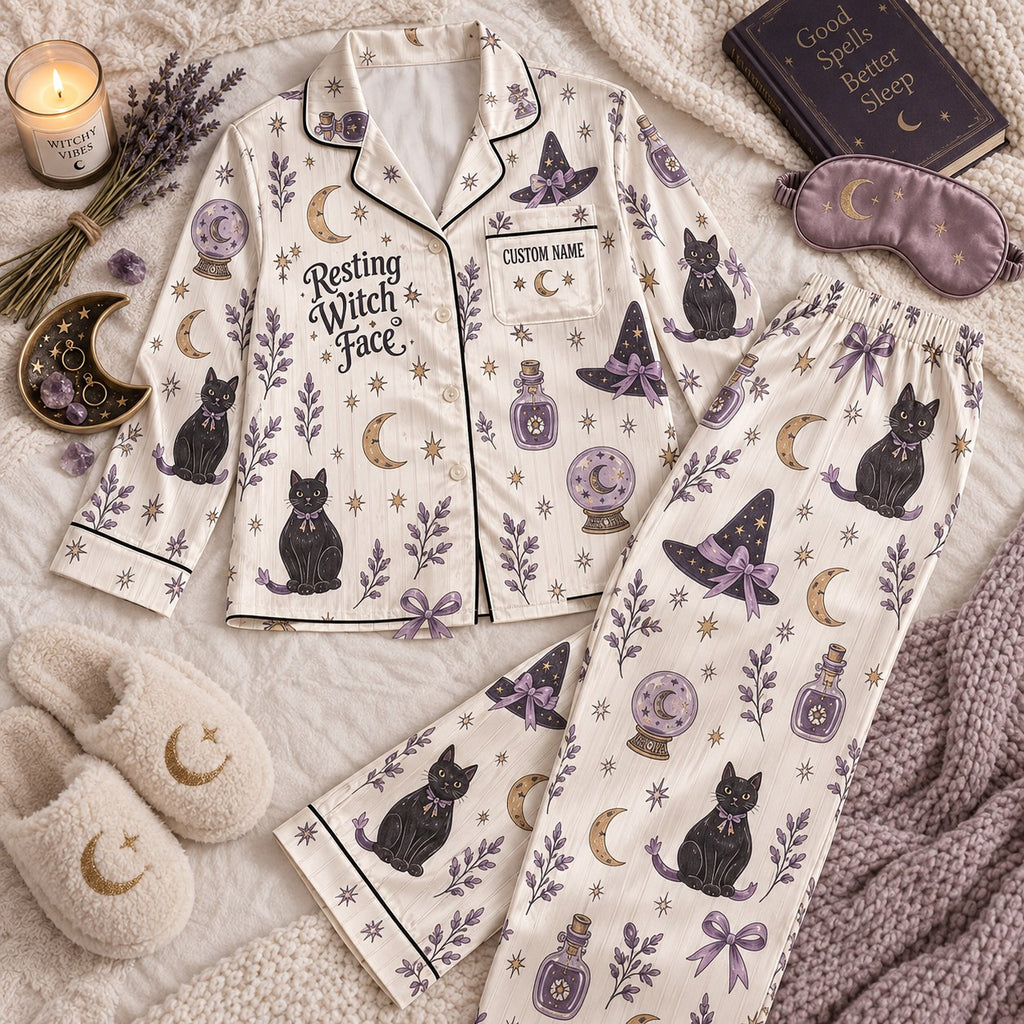 cream witchy cat satin pajamas flat lay with a custom name on the chest